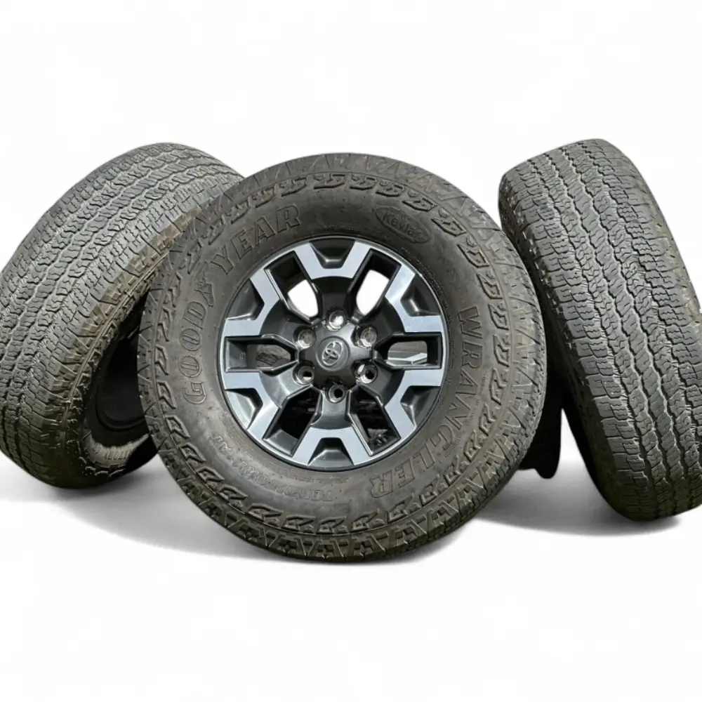 Toyota + Goodyear Toyota 6 Spoke Charcoal Machined 16x7.0 Wheels 6x139.7 Rims with Goodyear Wrangler Territory AT  Kevlar 265/70R16 Tires Wheel & Tire Package - View 3